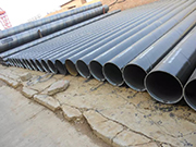 What is the stress state of spiral steel pipe during extrusion